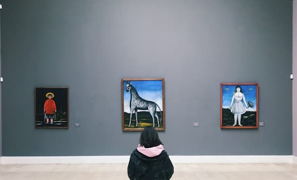 Gallery interior with framed paintings